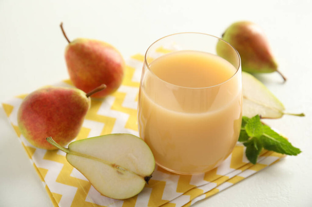 Tasty pear juice and fruits on white table, closeup - Photo, image