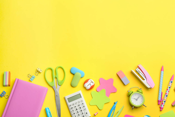 School stationery on yellow background, flat lay with space for text. Back to school - Fotografie, Obrázek