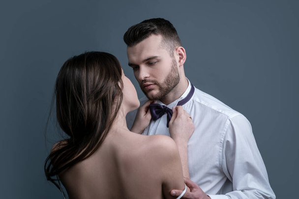 Marriage problems and sexual health. Sexy couple in intimacy relations. Sexy passion couple, beautiful young female and male faces closeup, studio shot. - 写真・画像