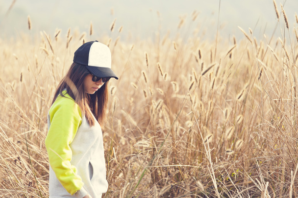Asian woman lonely in wheat farm - Photo, Image