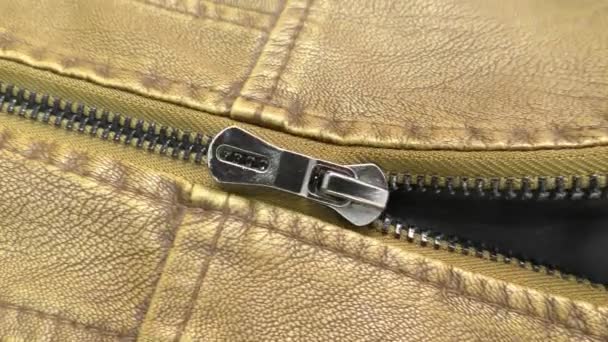 The zipper opens on the brown leather jacket. - Footage, Video