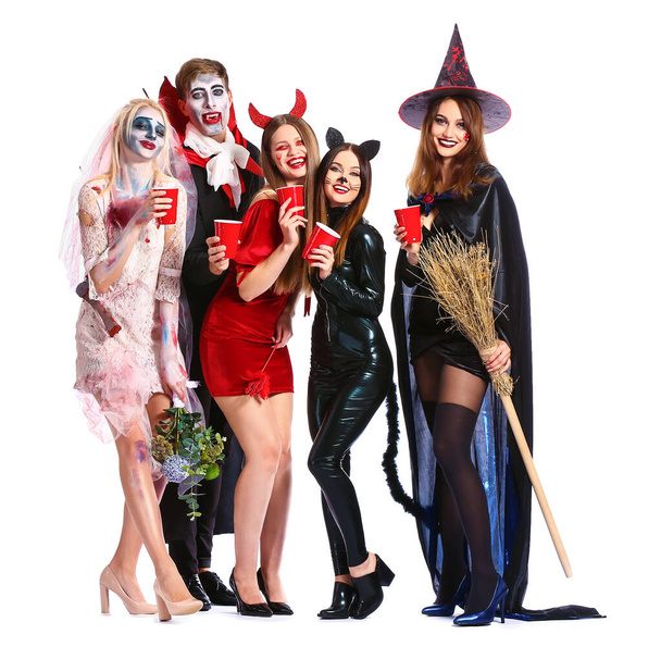 Freunde in Halloween-Kostümen auf weißem Hintergrund - Foto, Bild
