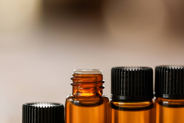 A shallow focus shot of essential oil bottles on a table - 写真・画像