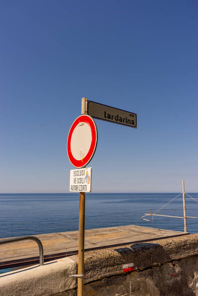 Europe, Italy, Cinque Terre, Corniglia, a sign on a beach - Valokuva, kuva
