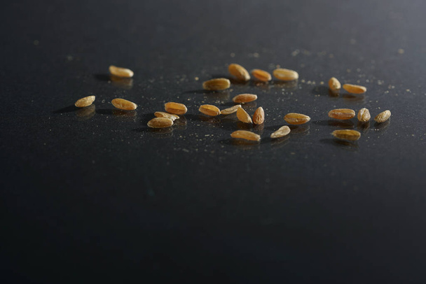 A closeup of cereal grains on the table with a blurry background - Photo, Image