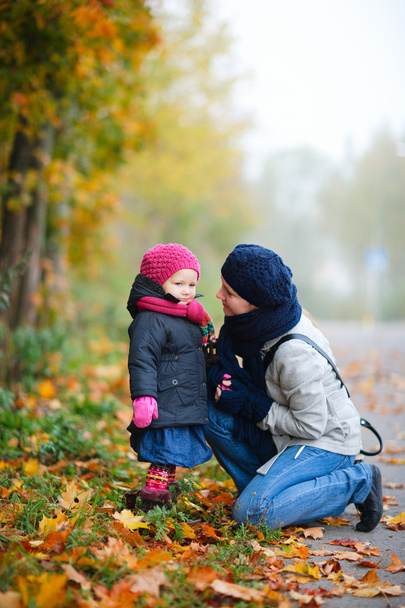 Mother And Daughter Outdoors On Foggy Day - 写真・画像