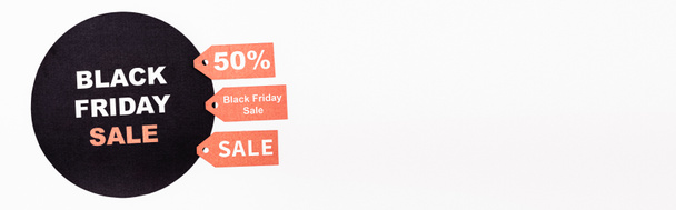 Website header of price tags and black circle with black friday sale lettering on white background - Photo, Image