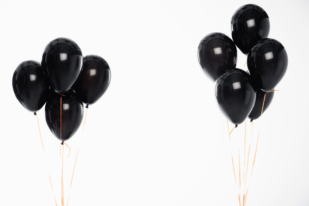 Slavnostní balónky na strunách izolovaných na bílém  - Fotografie, Obrázek