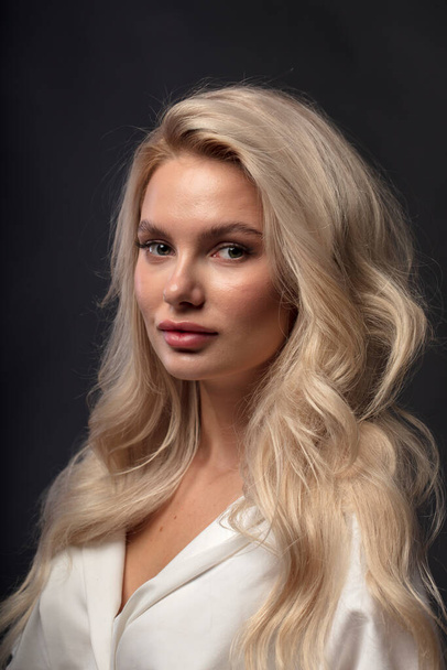 Blonde hair female model posing on camera  - Foto, Imagen
