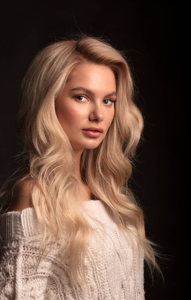 Blonde hair female model posing on camera  - Fotó, kép