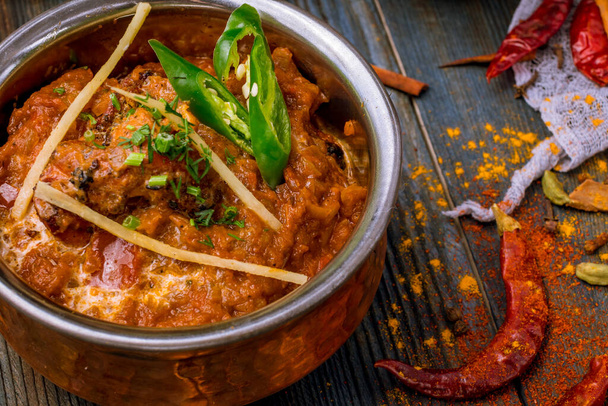 chicken tikka masala Indian food on wooden background with spices  - 写真・画像