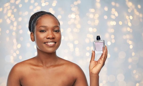 young african american woman with perfume - Photo, image