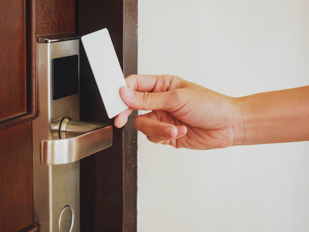 Hand Holding Key card Hotel room access Security access - Foto, Imagem