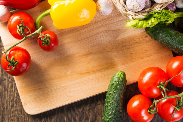 vegetables on the kitchen board - Фото, изображение
