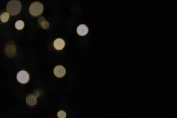 Christmas and New Years concept - defocused abstract multicolored bokeh lights background. Gold colors. - Foto, Imagem