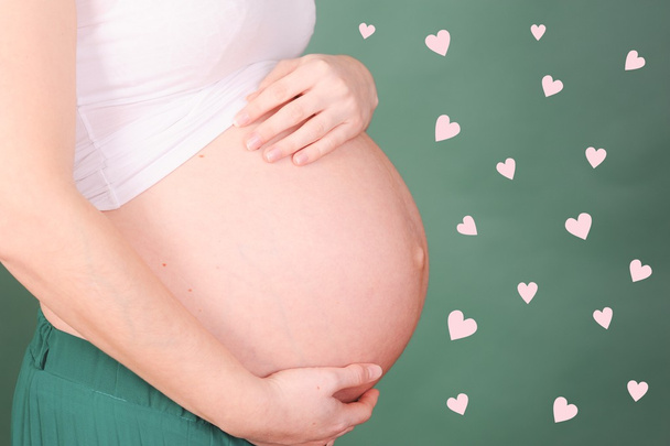 Pregnant woman with hearts - Photo, Image