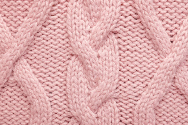 Kötött gyapjú háttér. Rózsaszín textúra kötött gyapjú pulóver - Fotó, kép