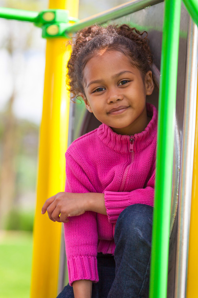 Portrait of a cute african little girl at playground - Фото, зображення