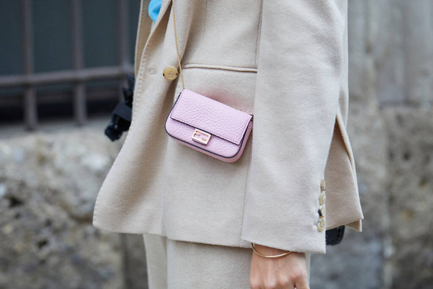 MILAN, ITALY - SEPTEMBER 24, 2020: Woman with pink Fendi leather bag and beige jacket before Max Mara fashion show, Milan Fashion Week street style - Zdjęcie, obraz
