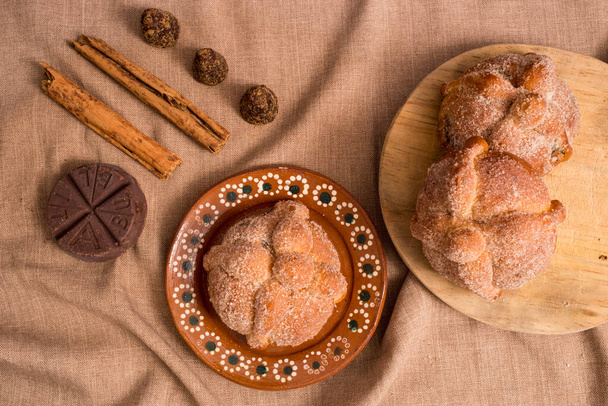Day of the dead traditional bread with brown sugar, cinnamon and chocolat - Photo, Image