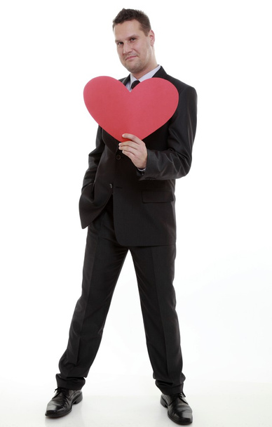 man holding red heart in his hand love symbol - 写真・画像