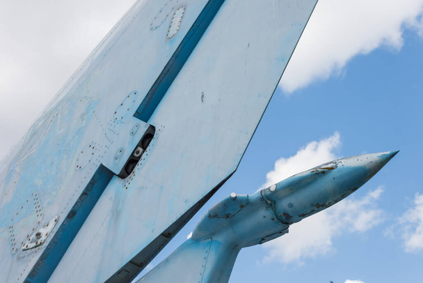 Details of the tail of the Soviet military aircraft on a background of blue sky. Close-up - Photo, Image