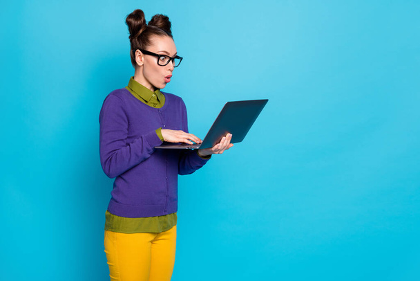 Portrait of her she nice attractive funny childish amazed cheery girl holding in hands laptop working web part-time isolated on bright vivid shine vibrant blue green teal turquoise color background - Zdjęcie, obraz