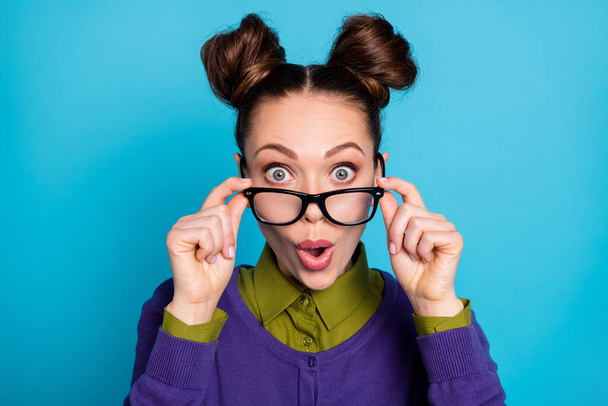 Closeup photo of attractive shocked lady two funny buns crazy good mood amazed perfect eyesight without specs wear shirt collar violet sweater isolated blue color background - Foto, Bild