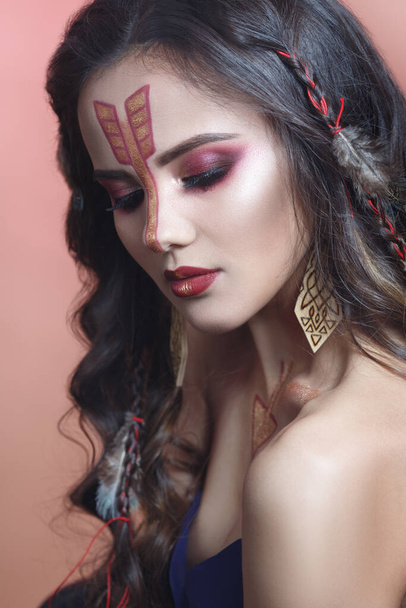Fashion beauty portrait of a beautiful long-haired brunette in the image of a zodiac Archer. - Foto, imagen