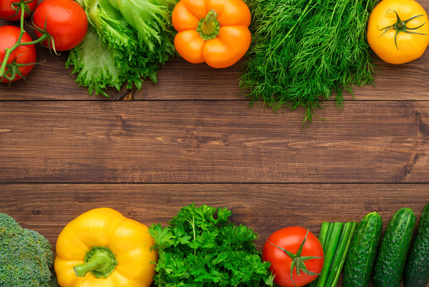 Healthy eating ingredients: fresh vegetables, fruits and superfood. Nutrition, diet, vegan food concept. Wooden background - Φωτογραφία, εικόνα