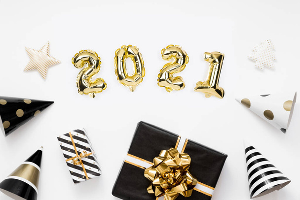  Happy New year 2021 celebration. Gold foil balloons numeral 2020 on white background - Fotografie, Obrázek