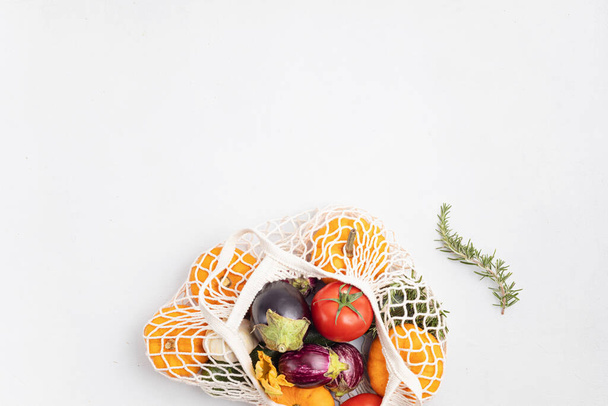Varieties of organic vegetables and fruits. Farmers crop, Buy local concept. Sustainable, plastic free, zero waste lifestyle. Top view, flat lay - 写真・画像