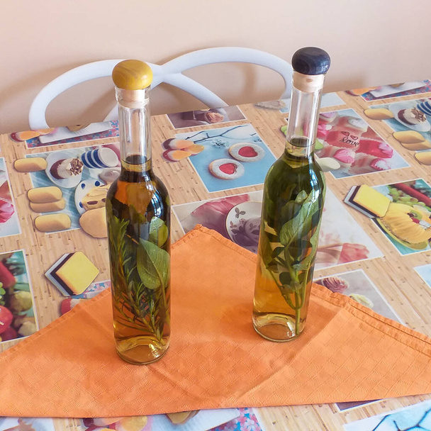 Grappa flavored with rosemary and sage from the garden. - Photo, Image