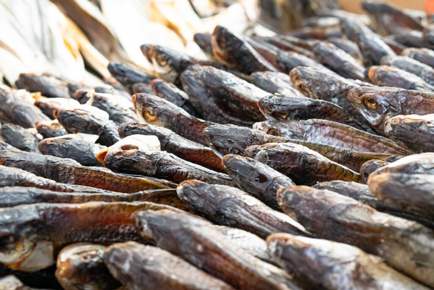 Dried fish of different types lies on the street market - Foto, Imagem
