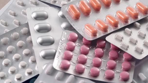 Close-up view of packages with medical pills rotating. Pharmaceutical Industry. The medicine concept. - Footage, Video