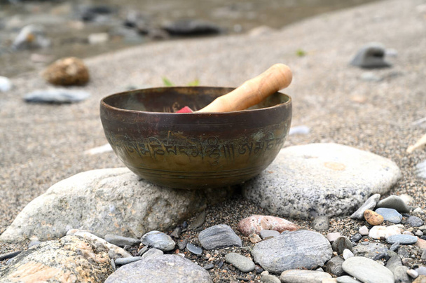 A tibetan singing bowl in a natural environment. - Photo, Image