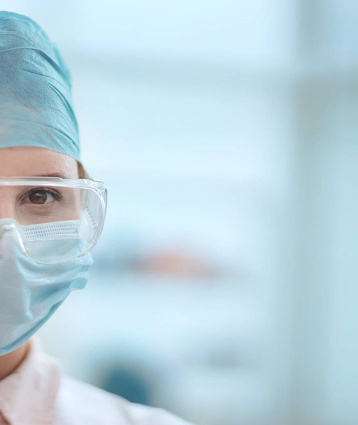 female scientist with a blank badge standing in the lab. - Φωτογραφία, εικόνα