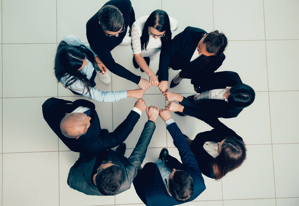 top view. group of young professionals standing in a circle - Foto, immagini