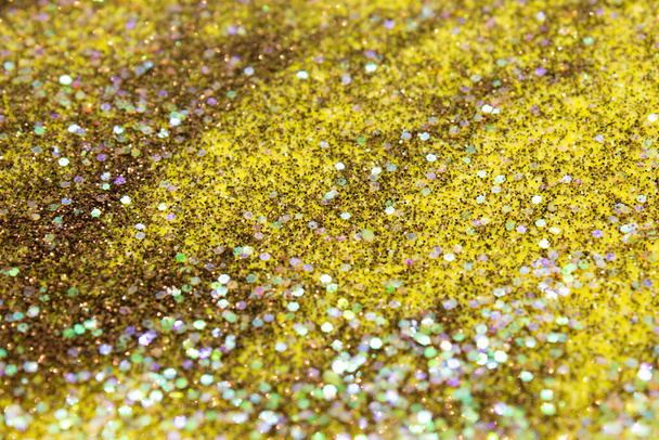 Bruine en gele glitter en lovertjes achtergrond - Foto, afbeelding