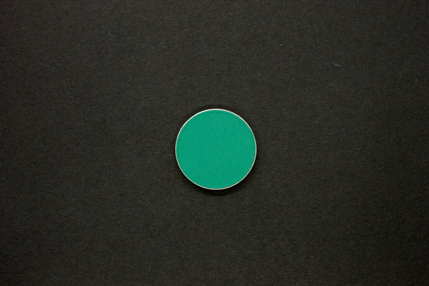 Green Eyeshadow isolated on a Black background - Photo, Image