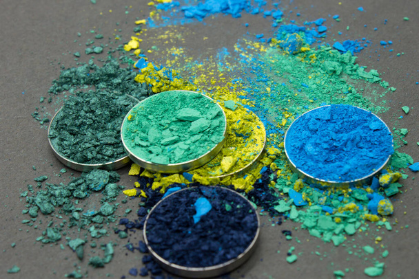 Shades of Blue and Green crushed Eyeshadow on a Black background - Photo, Image