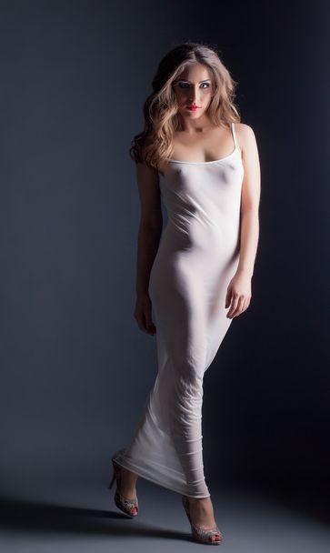 Charming model posing in skin-tight negligee - Фото, изображение