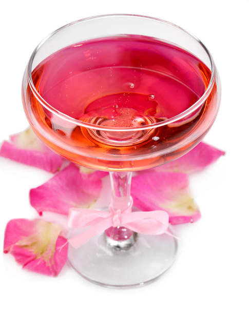 Composition with pink sparkle wine in glass and  rose petals isolated on white - Valokuva, kuva