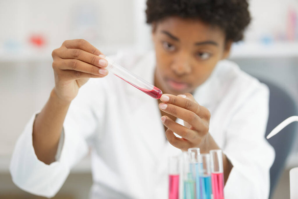 concentrated smart scientist conducting a blood test - Φωτογραφία, εικόνα