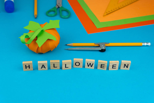 Step 10. Step by step instructions on how to make a pumpkin from colored paper or cardboard. Do it yourself. Glue, a ruler, compasses, scissors. A DIY craft for children. Decoration for the Halloween - 写真・画像