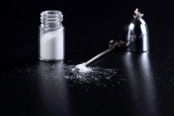 Cocaine on a Black Background, Cocaine Bottle   - Фото, зображення