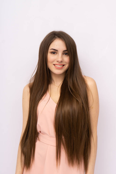 Young woman with long hair. Brunette - Zdjęcie, obraz