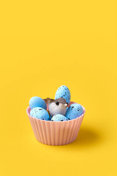 Muffin with easter blue eggs and bird. Springtime concept. Creative conceptual photo - Foto, Imagem