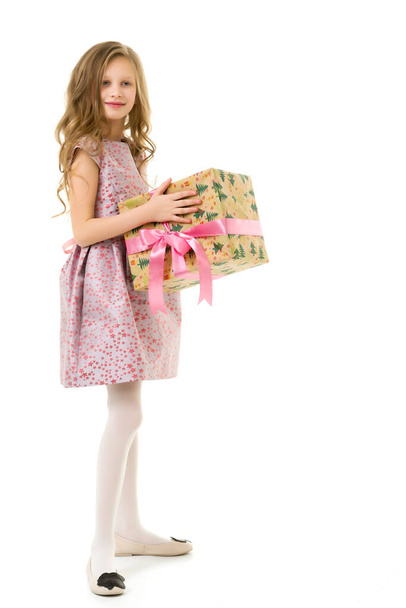 Cheerful Beautiful Blonde Girl in Pink Dress Holding Gift Box - Photo, image