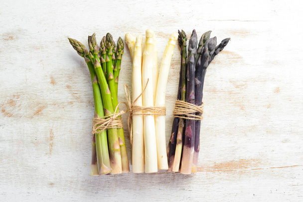 Asparagus. Raw organic asparagus brunch. Top view. Free space for your text. - Photo, image